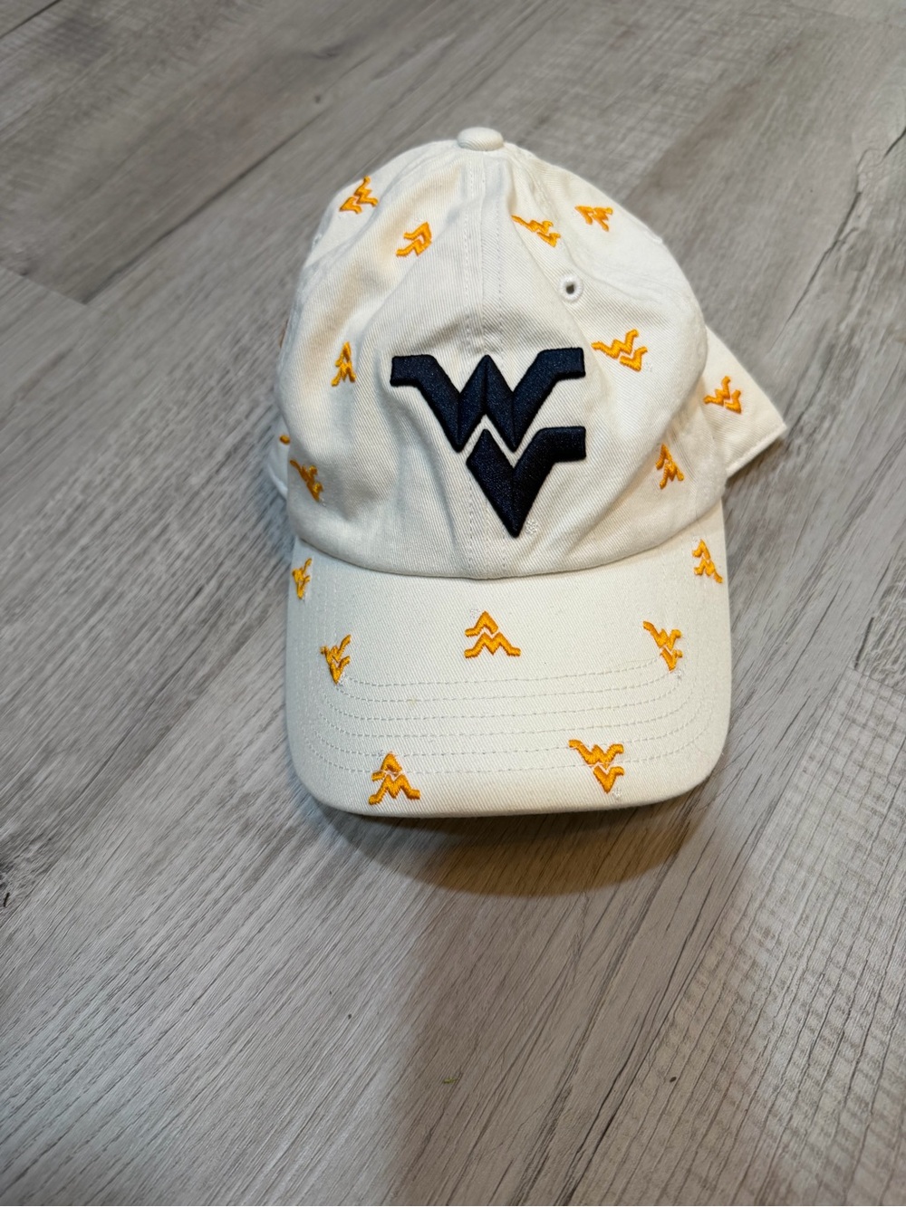 Embroidered White Baseball Cap with Navy Logo and Gold Accents